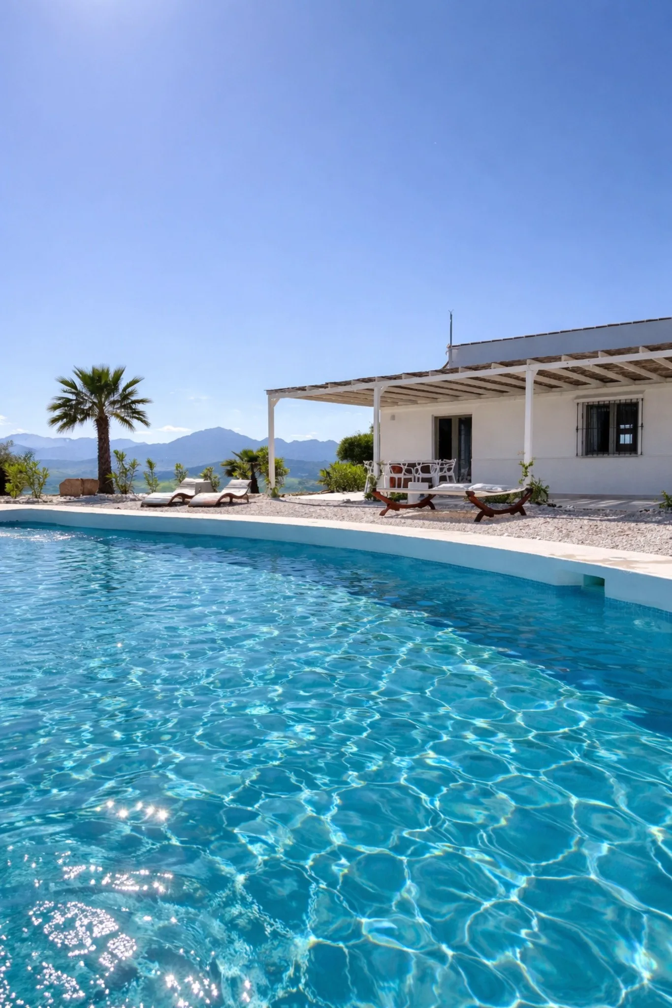 Casa Lux turquoise private pool with villa, terraces and Andalusian mountain views