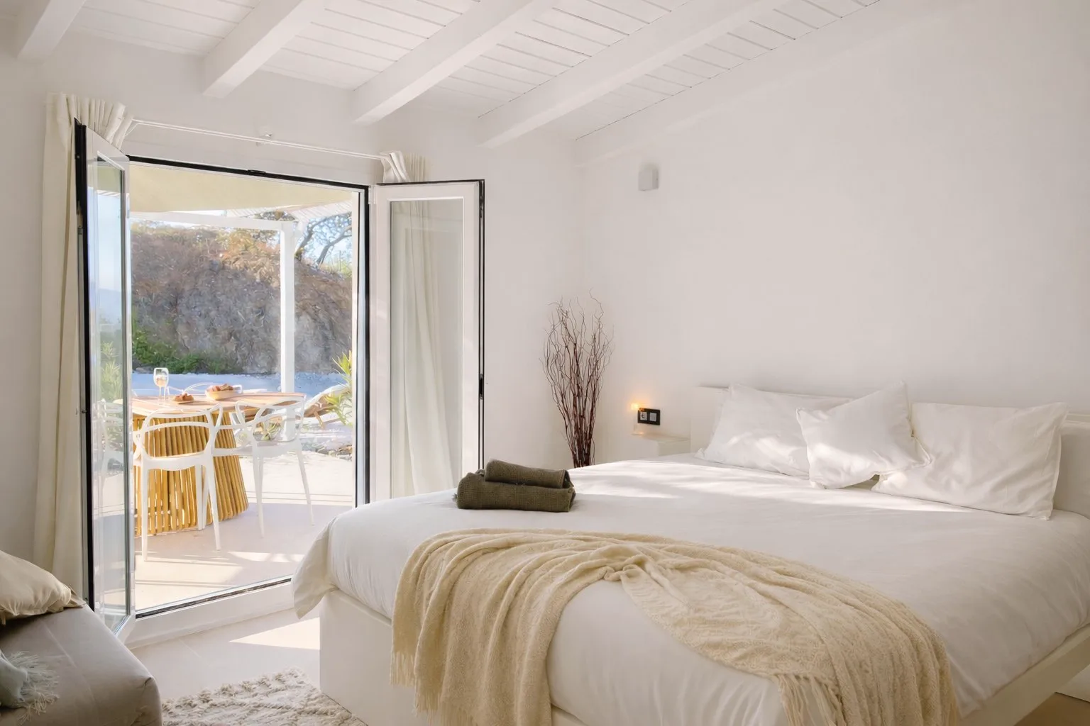 Casa Lux bedroom opening onto the terrace